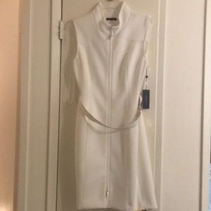 We are selling a white dress that includes a belt